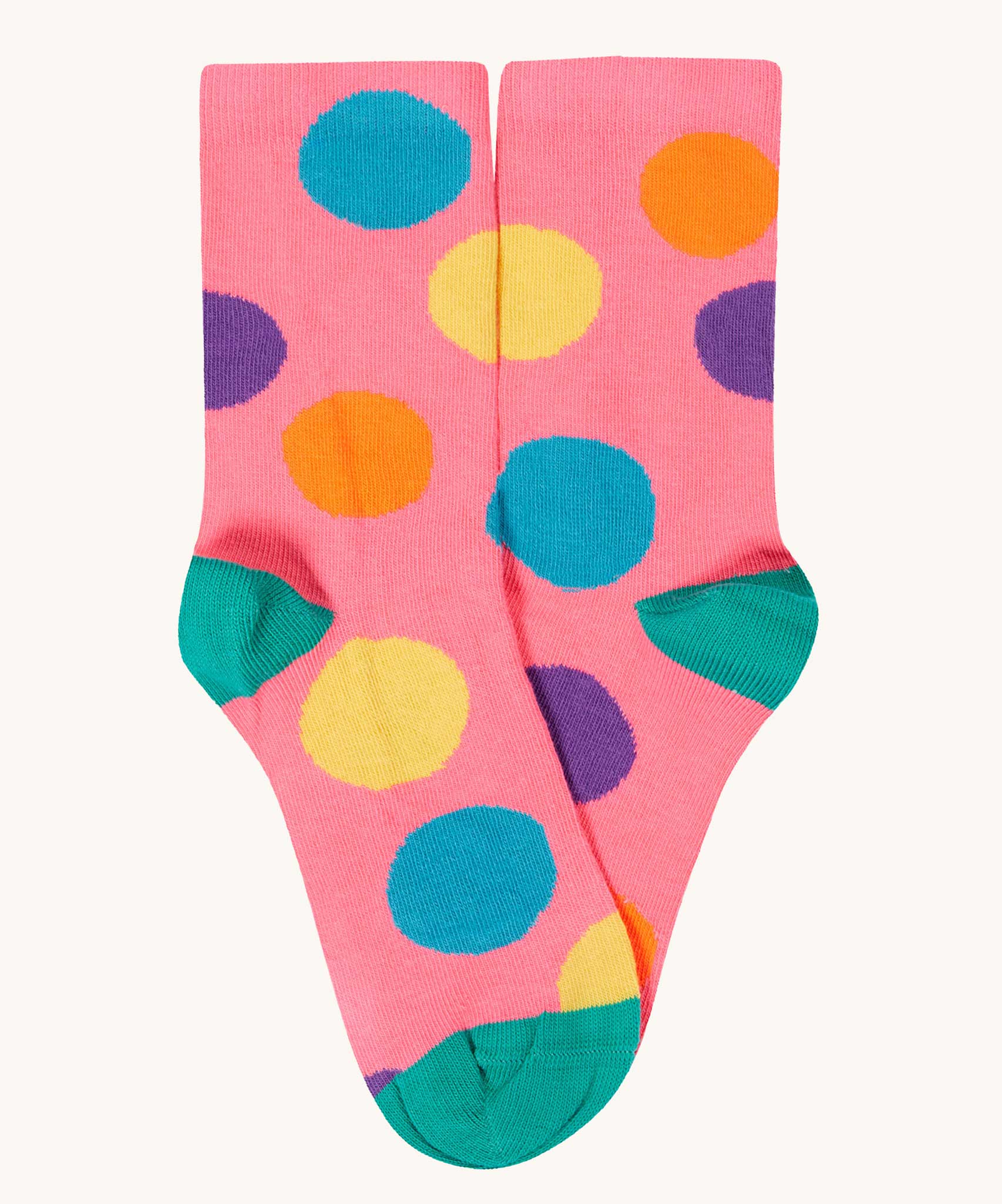 The pink multi-coloured spotted socks from the Frugi rock my socks flowers socks multi-pack of children's organic cotton socks.