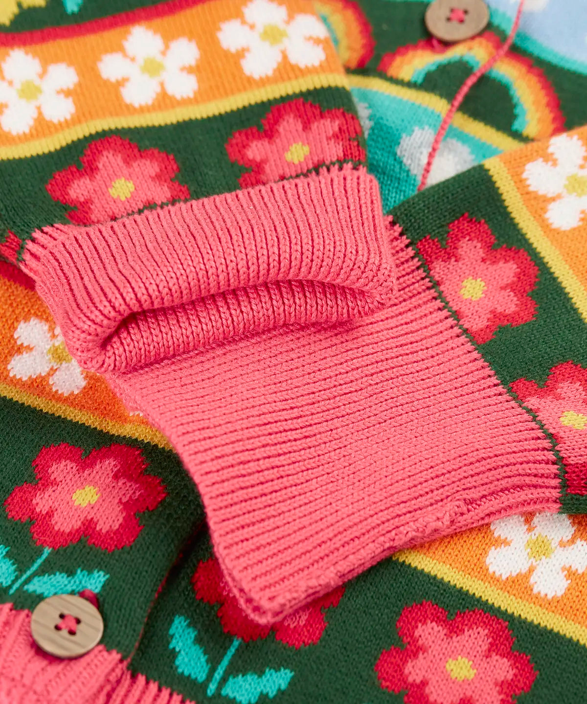 Close up of the pink fold down cuffs on the Frugi Robyn fairisle cardigan with a mouse Fair Isle design.