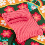 Close up of the pink fold down cuffs on the Frugi Robyn fairisle cardigan with a mouse Fair Isle design.