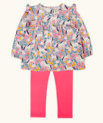 Frugi organic cotton Charlotte outfit. All over floral flight, frilled shoulder long sleeve top with rhubarb pink leggings.