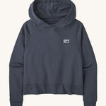 Patagonia Women's Regenerative Essential Hoody - Smolder Blue. A navy blue hoody with a small Patagonia logo on the chest
