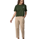An adult wearing the Patagonia Women's Easy Cut Organic T-Shirt - Pine Green. The image shows a small earth logo on the front of the chest