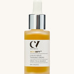 Green People Age Defy+ Liquid Gold Tanning Drops 30ml on a cream background
