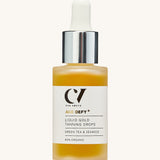 Green People Age Defy+ Liquid Gold Tanning Drops 30ml on a cream background