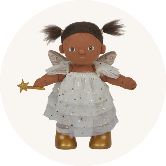 Olli Ella Dream Dinkum Freya Fairy, a toy baby doll with brown hair, brown skin dressed in a pretty fairy costume with a ruffled dress and wand, to represent new Olli Ella at Babipur.