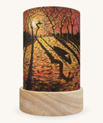 The Autumn Courage illustration by Kapitein Kalk sat in a Toverlux Magic Lantern base, on a cream background