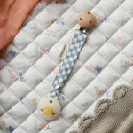 Avery Row Pacifier Holder - Waves. A blue and white check fabric on the Avery Row Waves/Coastline bedding