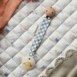 Avery Row Pacifier Holder - Waves. A blue and white check fabric on the Avery Row Waves/Coastline bedding