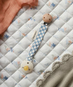 Avery Row Pacifier Holder - Waves. A blue and white check fabric on the Avery Row Waves/Coastline bedding