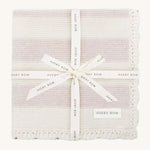 Avery Row Stripe Knit Organic Baby Blanket - Oat Melange, a knitted white and oatmeal stripe baby blanket wrapped in a branded gift ribbon. 