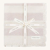 Avery Row Stripe Knit Organic Baby Blanket - Oat Melange, a knitted white and oatmeal stripe baby blanket wrapped in a branded gift ribbon. 