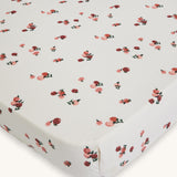Avery Row Cotbed Fitted Sheet - Peaches. A light cream sheet with delicate peach print
