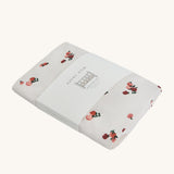 Avery Row Cotbed Fitted Sheet - Peaches on a plain background