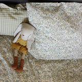 Riverbank Avery Row Organic Cotton Bedding Set, with a soft bunny toy laid on top