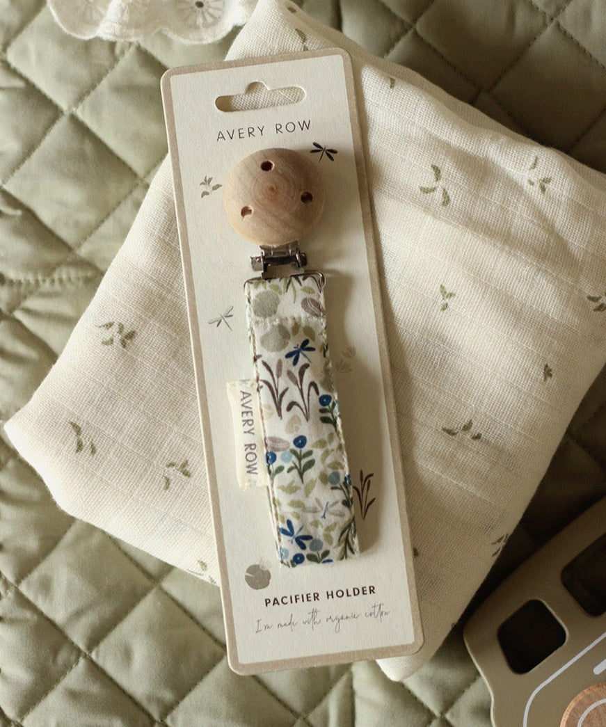 Avery Row Pacifier Holder - Riverbank. A beautfiful Riverbank nature inspired fabric, laid out on an Avery Row Nature Trail muslin cloth