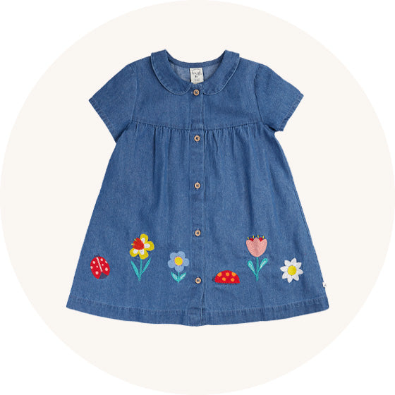 Frugi Rosemary Denim Dress with short sleeves, buttons down the front, peter pan collar and embroidered flowers on the hem, made from organic cotton, to represent baby skirts and dresses at Babipur.