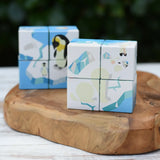 Bajo 2-in-1 polar jungle wooden cube block puzzle placed on a wooden surface in two stack featuring the polar design side.