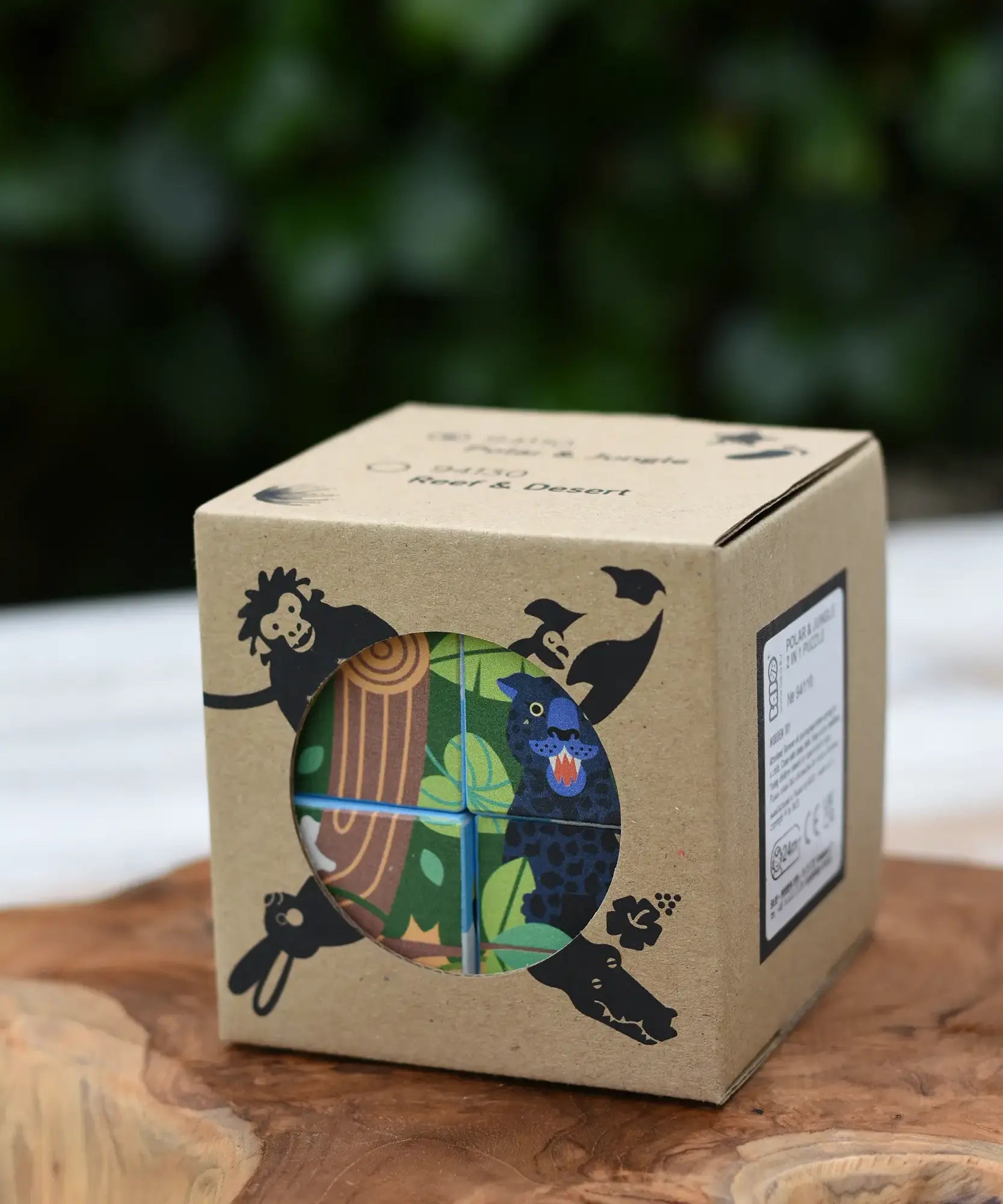 Bajo 2-in-1 polar jungle wooden cube block puzzle shown in it's cardboard box.