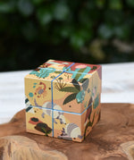 Bajo 2-in-1 reef desert wooden cube block puzzle shown on the desert design side.