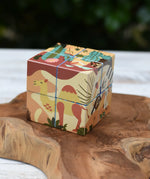 Bajo 2-in-1 reef desert wooden cube block puzzle shown on the desert design side with an illustration featuring a camel.