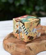 Bajo 2-in-1 reef desert wooden cube block puzzle shown on the desert design side, 