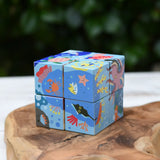 Bajo 2-in-1 reef desert wooden cube block puzzle shown with the reef design side.
