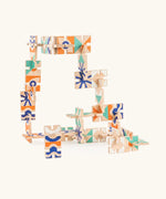A 3D game made from the Bajo wooden dominoes with abstract designs.