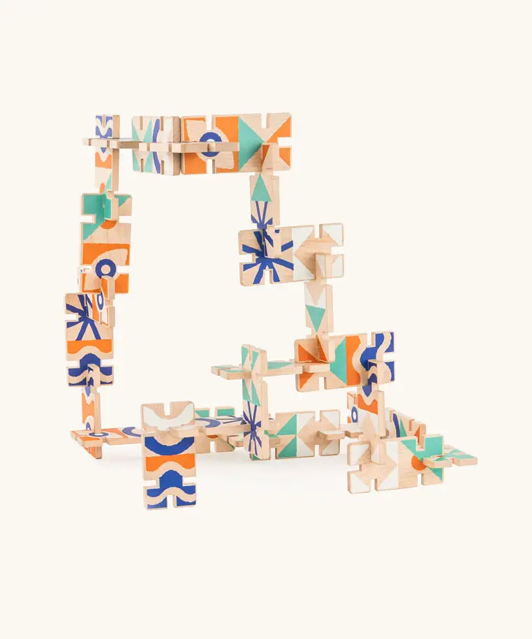 A 3D game made from the Bajo wooden dominoes with abstract designs.