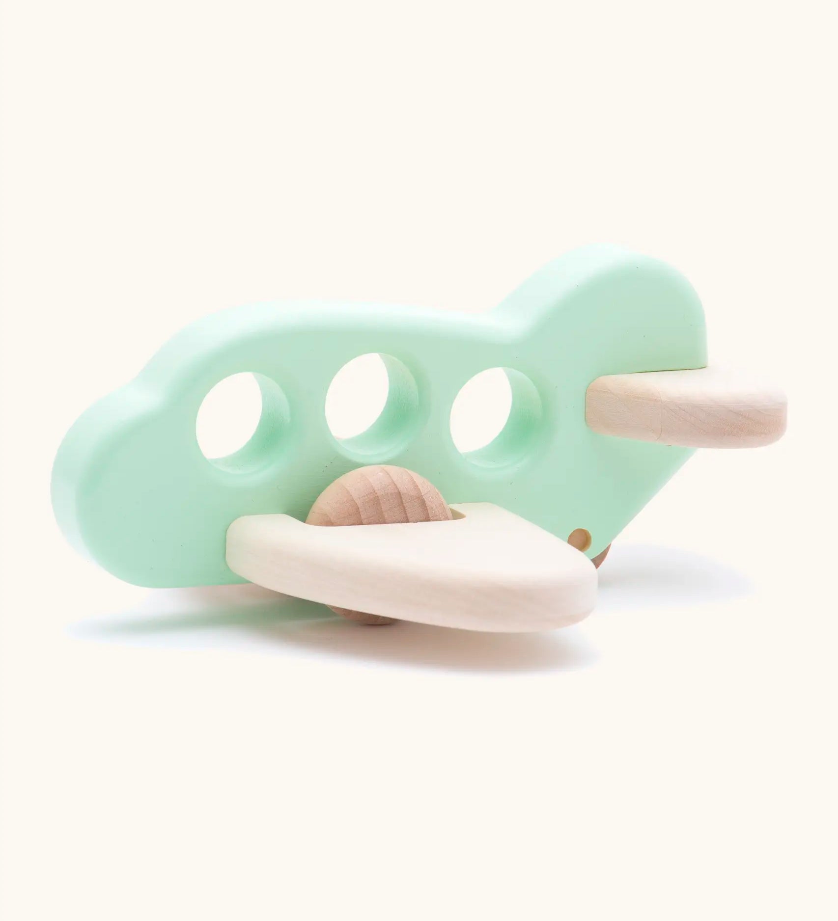 Bajo wooden airplane in light mint with 3 cut out holes for window and unpainted wheels and wings