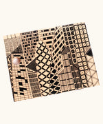 Bajo city puzzle set showing different shaped wooden building pieces with black detailing laid flat