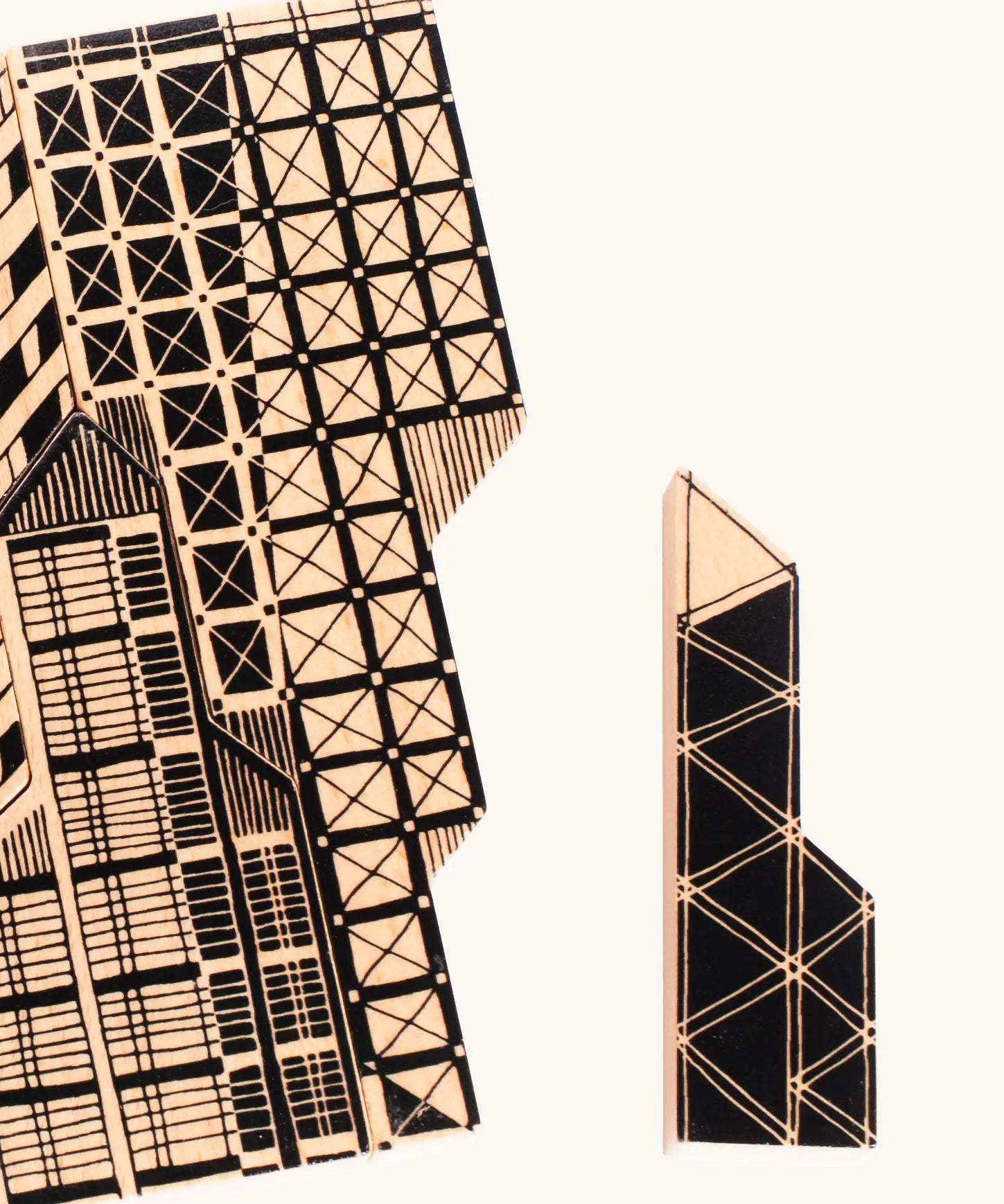 A 3d wooden tower piece from the Bajo city puzzle set showing painted building detail