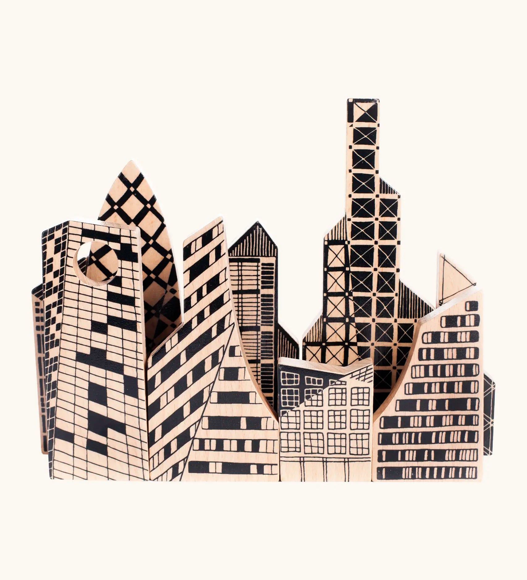 Bajo city puzzle set showing different shaped wooden building pieces with black painted detailing