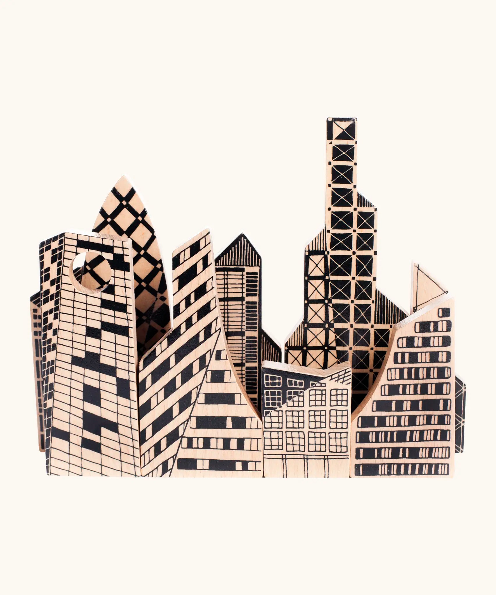 Bajo city puzzle set showing different shaped wooden building pieces with black painted detailing