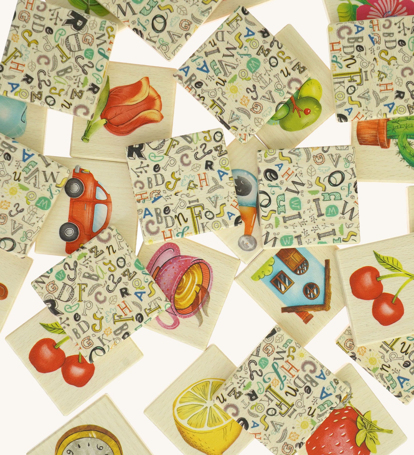 A pile of wooden tiles from the Bajo classic memory game available at Babipur. Showing the different illustrations on the wooden square tiles.