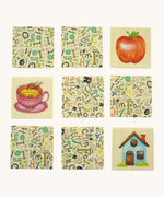  9 wooden tiles from the Bajo classic memory game available at Babipur. Laid flat showing the different illustrations 