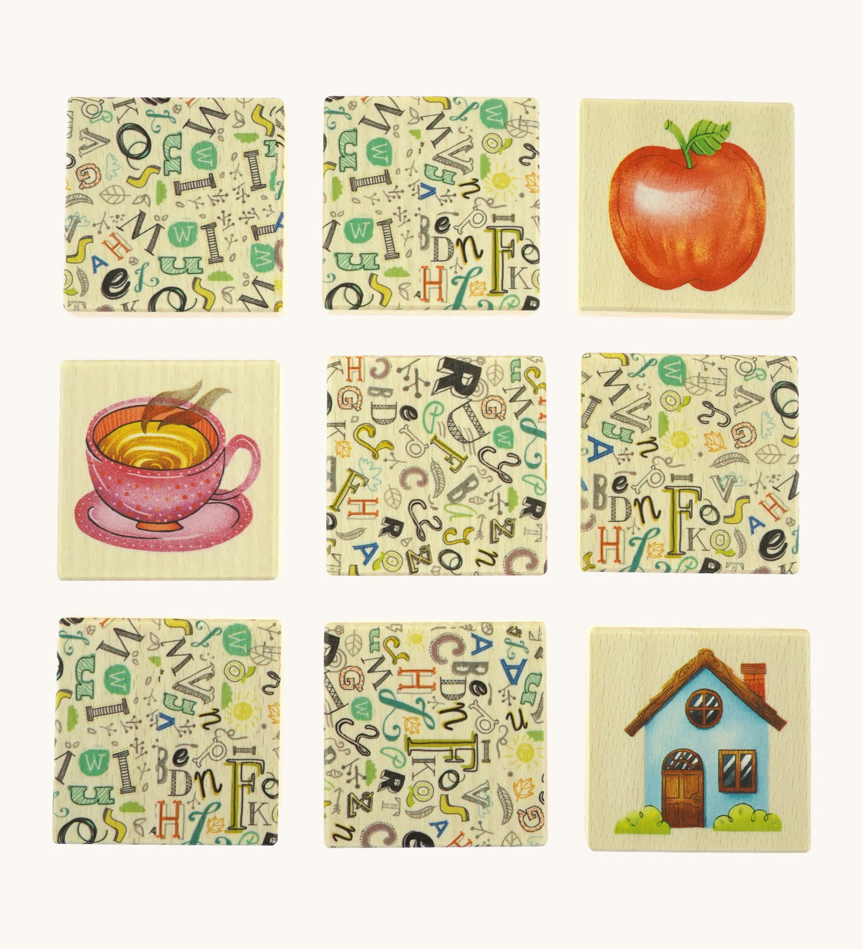 9 wooden tiles from the Bajo classic memory game available at Babipur. Laid flat showing the different illustrations 