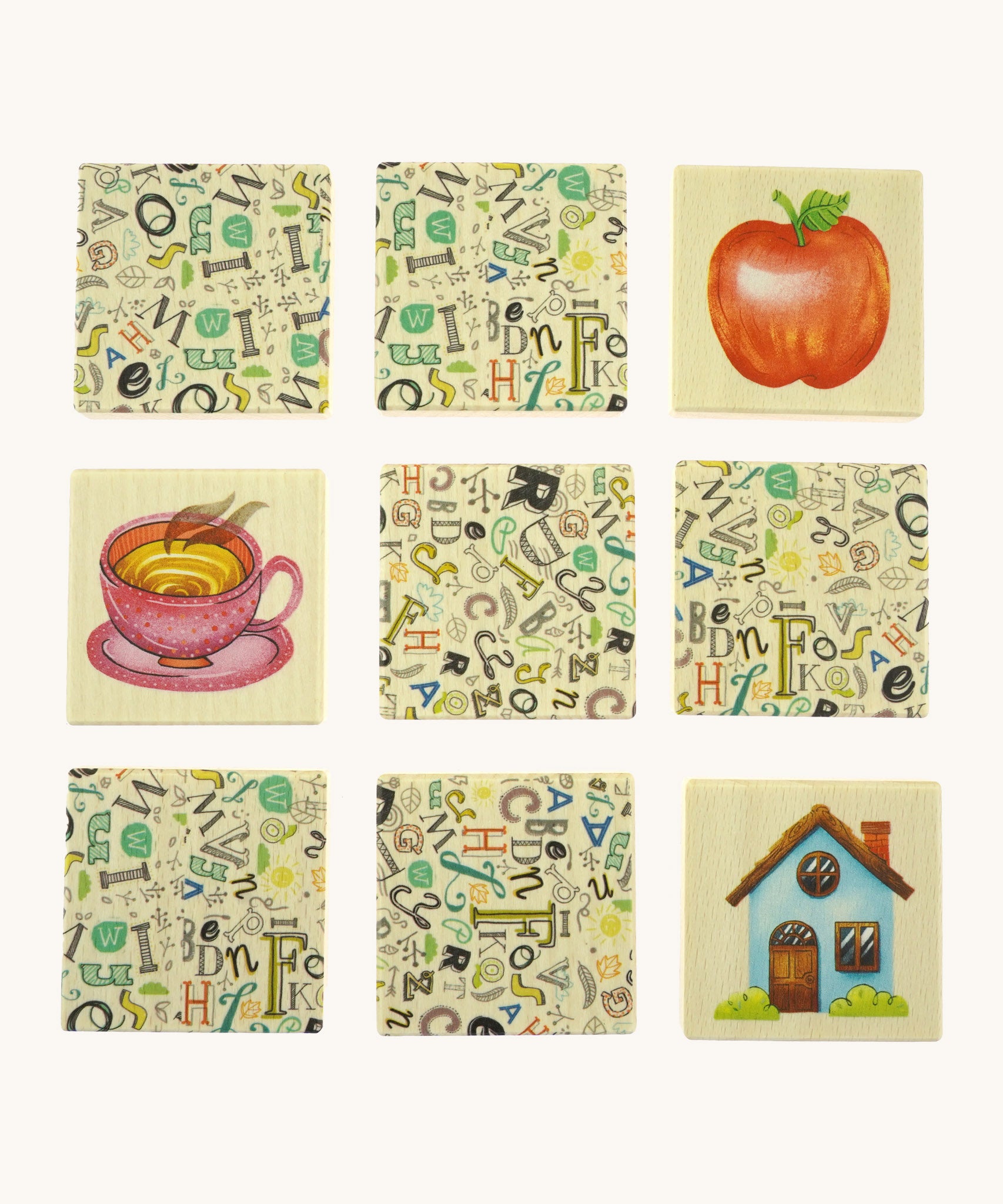  9 wooden tiles from the Bajo classic memory game available at Babipur. Laid flat showing the different illustrations 