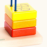 Yellow wooden block with the 3 lemons on top from the Bajo count to 5 arched toy