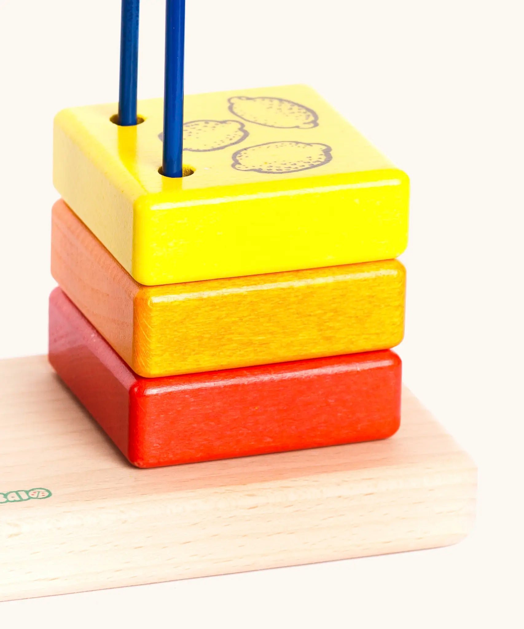 Yellow wooden block with the 3 lemons on top from the Bajo count to 5 arched toy