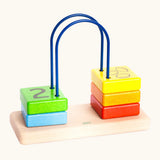 Bajo count to to 5 arched toy showing 5 wooden coloured blocks with a number on one side and fruit on the reverse side  