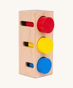 Bajo deep and shallow shape sorter puzzle set available at Babipur. A rectangular shape base standing upright with the with 3 different coloured tubes inside the deep cut outs
