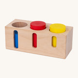 Bajo deep and shallow shape sorter puzzle set available at Babipur. The rectangular shape wooden base has the 3 coloured tubes inside the deep cut outs