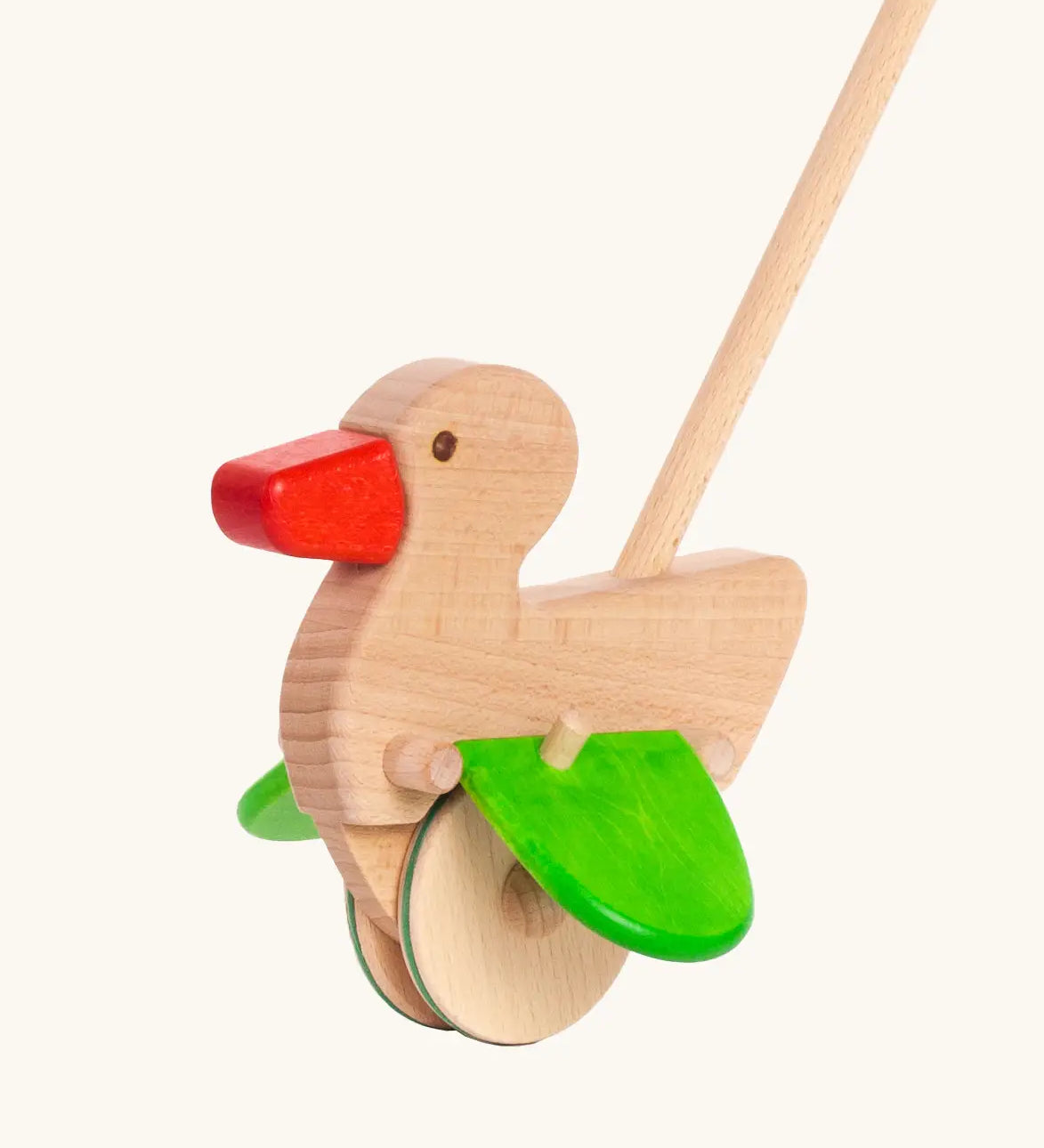 Unpainted wooden duck with a red beak, green wings and wheels on the Bajo push along toy