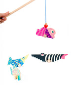 A closer look at the Bajo Magnetic Fishing Game pole, picking up a fish. On a white background