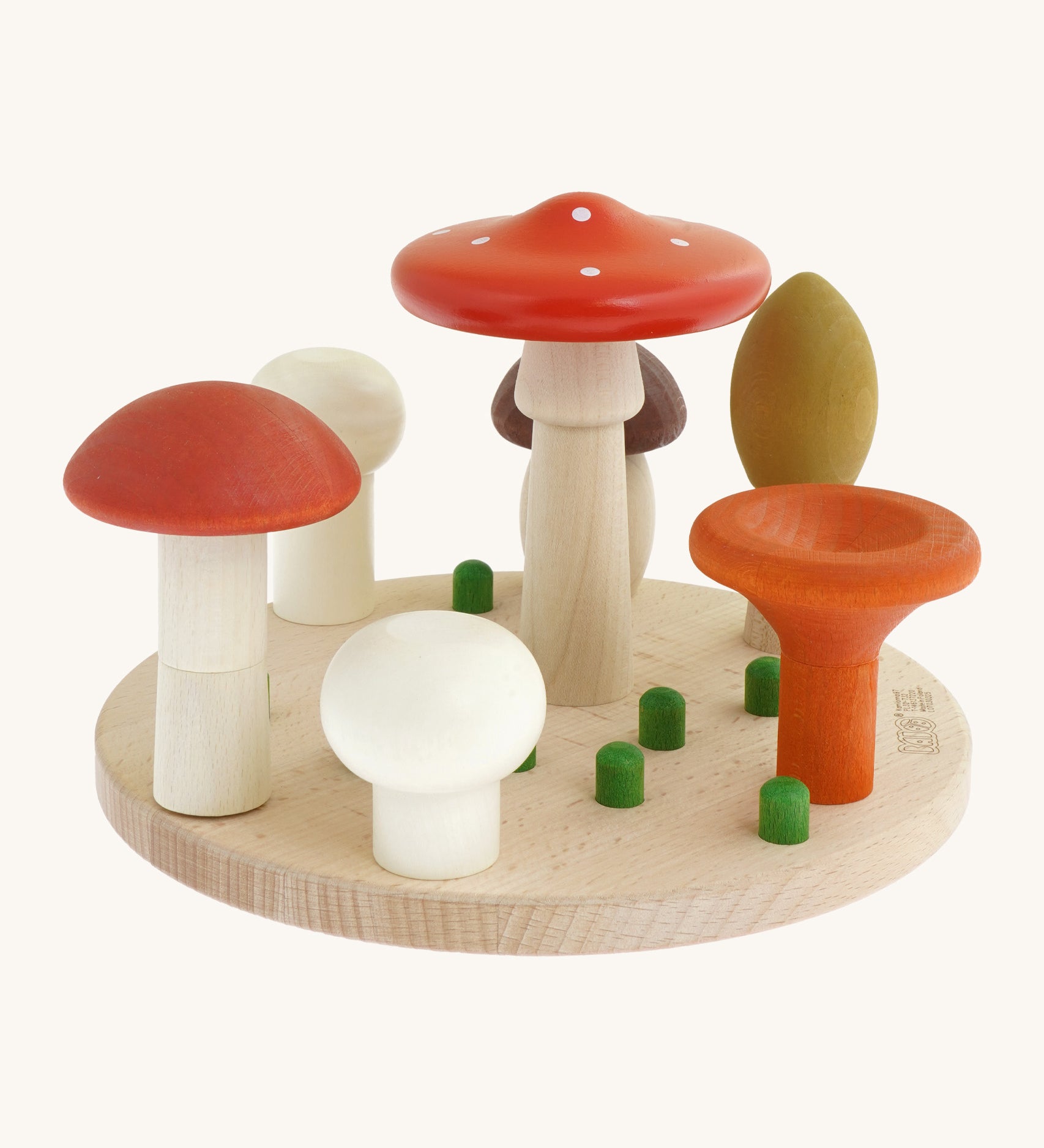 Bajo wooden mushroom shape sorter available at Babipur. Set comes with a wooden circular base with green pegs for 7 different types of mushrooms to slot in