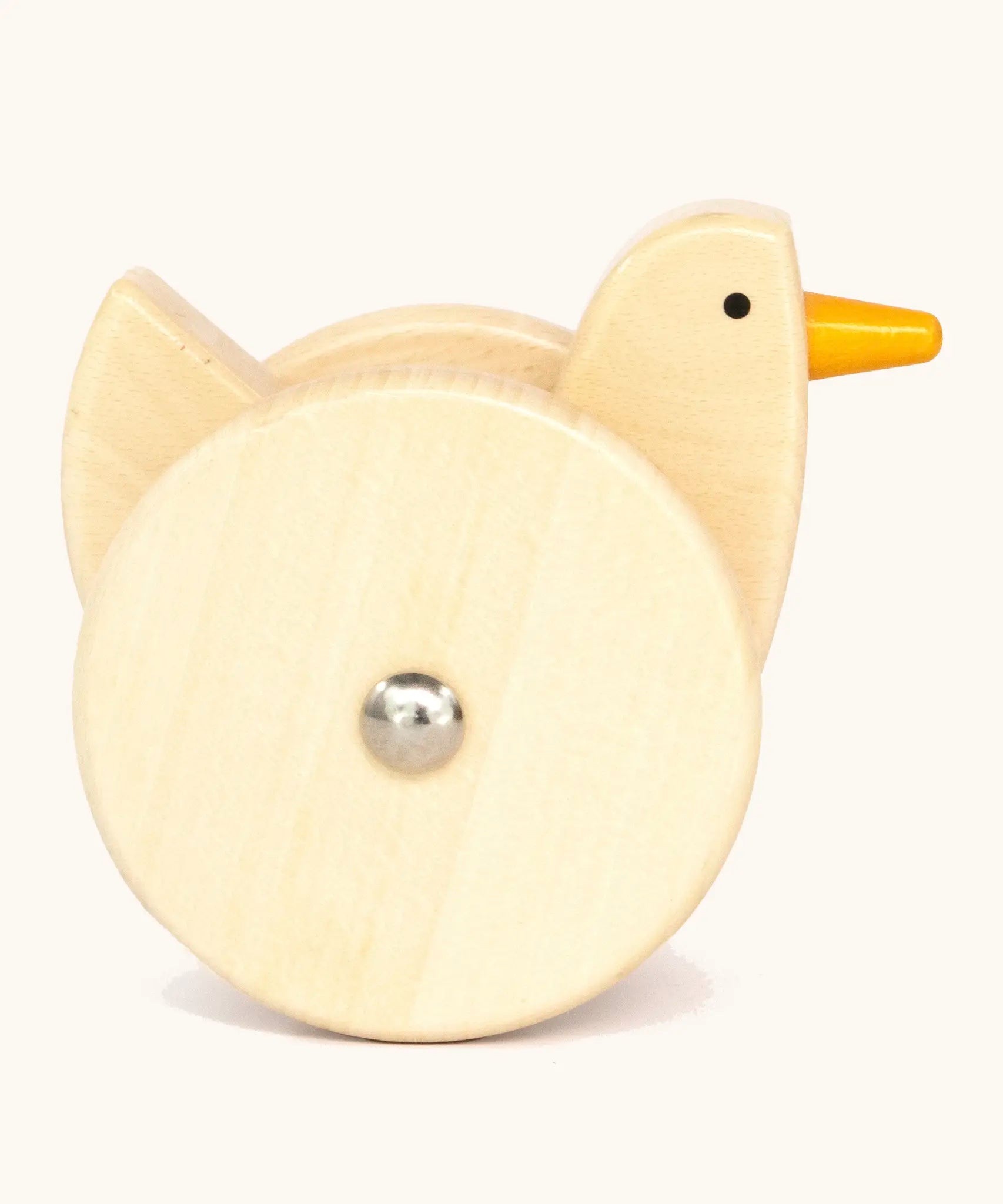 Side of Bajo wooden wobbling chicken toy showing large wheel on the side 