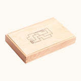 Wooden storage box holding the coloured blocks from the Bajo Pentomino puzzle set