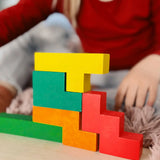A simple structure made from different Bajo wooden coloured Pentomino puzzle blocks