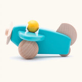 Bajo wooden light blue plane with a yellow pilot, unpainted wheels, propellors and rudder