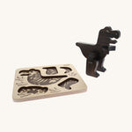Bajo Puzzle & Sorter - Black Oak T-Rex on a cream background. The image shows the build wooden t-rex stood next to is wooden puzzle board